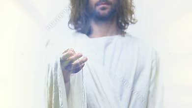 Jesus Christ reaching out hand helping to poor people, belief and spirituality