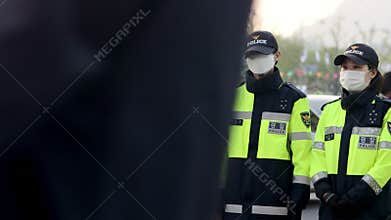 Seoul, South Korea - April 16, 2019: A young girl with a red placard protesting