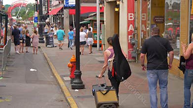 Young musician walking on Nashville Broadway - Nashville, United States - June 16, 2019