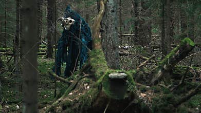 Horrible creature standing among trees in forest. Terrible monster