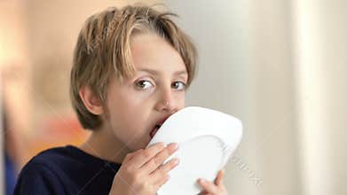 Cue Boy Enjoing Cake