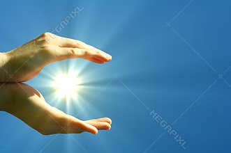 Hand sun and blue sky