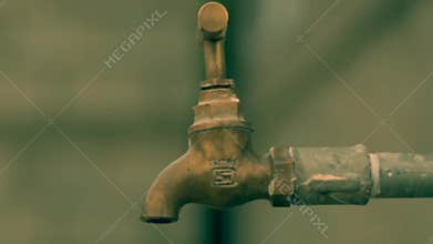 Closeup Cinematic look of a leaking dry water tap