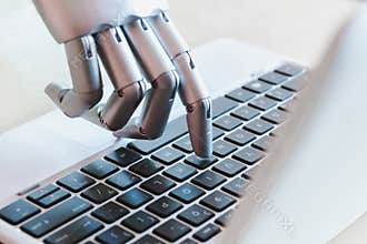 Robot hands and fingers point to laptop button advisor chatbot robotic artificial intelligence