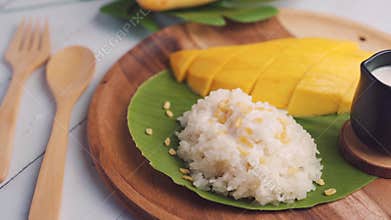 Thai mango with sticky rice, Thai desserts are made from ripe mango and sticky rice cook until cooked, sprinkle with coconut milk