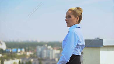Worried business woman thinking of problem at outdoor office terrace, stress