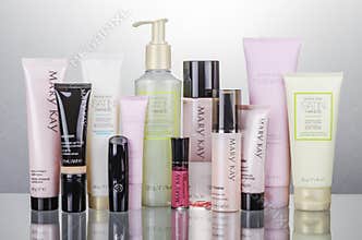 Set of Mary Kay cosmetics isolated on gradient background.