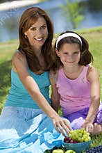 Mother & Daughter Eating Healthy Fruit Picnic