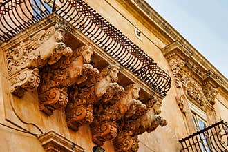 Balconies in Baroque style of Via Nicolaci in Noto, Sicily, Italy