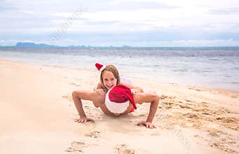 Young friendly family father and dauther are happy in summer Christmas on beach