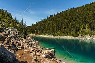 Garibaldi Provincial Park, CANADA - JUNE 16, 2019: view at the lake beautiful sunny morning with clouds on bluew sky