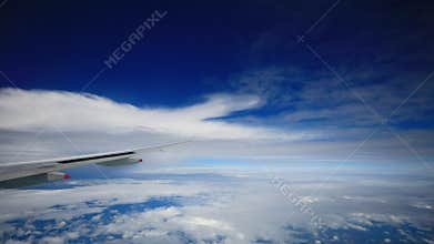Jet plane flying over cloudy sky