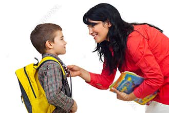 Mother preparing son for school