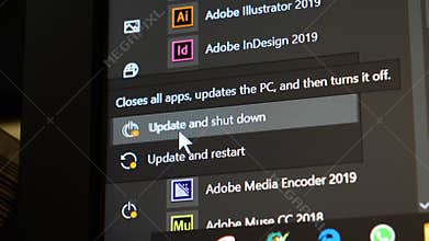 Microsoft windows Start key and selecting Update and Shut down computer