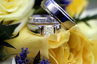 Wedding rings over bouquet