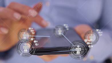 Businesswoman hands using futuristic application on a smartphone