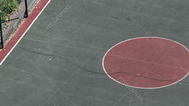 Aerial view undefined man playing football at summer day.