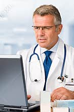 Mature doctor at work