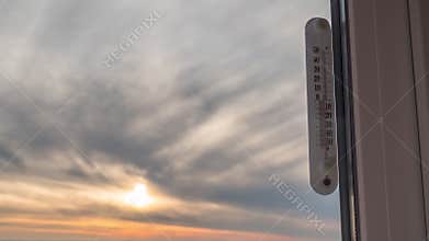 Temperature Thermometer Outside the Window and Changing Weather in Timelapse