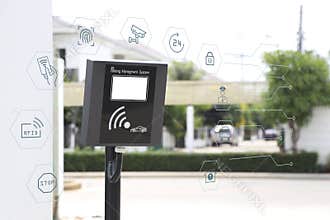 Automatic barrier gate and RFID card dispenser system with security icon around.
