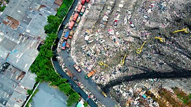 Aerial View. Large landfills like mountains. the tractor take garbage on landfills at Bekasi - Indonesia