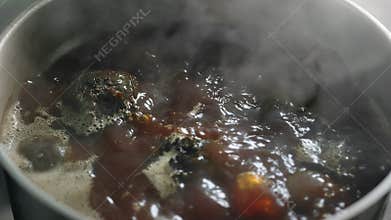 Top view fresh beet cooking at boiling water pan slow motion. Close up shot on 4k RED camera