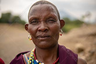 TANZANIA, MASAI VILLAGE - JANUARY 2020: Portrait of Maasai woman people in native masai village Engare Sero on the coast