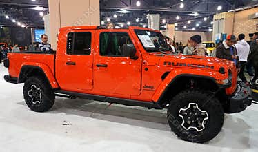 Philadelphia, Pennsylvania, U.S.A - February 9, 2020 - A bright orange 2020 Jeep Gladiator Rubicon 4X4