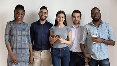 Happy diverse business people or students standing looking at camera