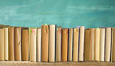 Row of vintage books, background or web banner free copy space.Reading, education, literature, book fair concept