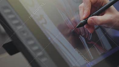 Wallpaper production. Drawing on a graphics tablet. The designer draws on a graphics tablet. Working with interactive