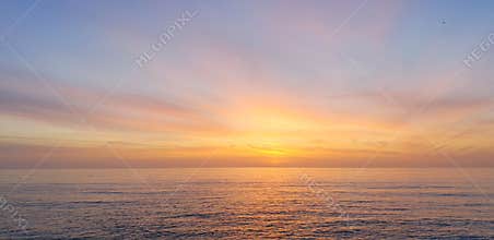 Calm pastel colored beach sea ocean sunset