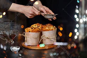The cook decorates cakes baked