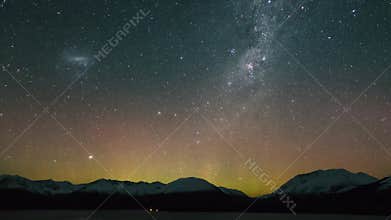 Timelapse view of beautiful northern lights Aurora Borealis and night sky above northern lake, static camera