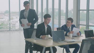 Business group meeting with manager giving handout document report with employee