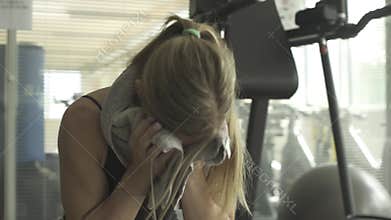 Woman having a break at the gym
