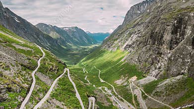 Trollstigen, Andalsnes, Norway. Cars Goes On Serpentine Mountain Road Trollstigen. Famous Norwegian Landmark And Popular