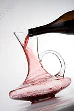 Pouring red wine into decanter