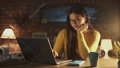 Smiling woman chatting with her laptop