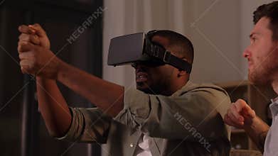 Male friends with vr glasses at home at night