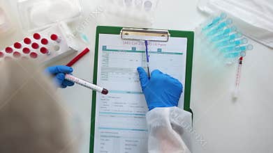 Express test covid-19. Laboratory assistant records the results of a serological blood test. PCR method for the