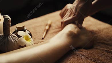 Professional foot massage close up.