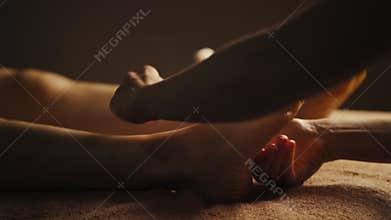 Professional foot massage close up.