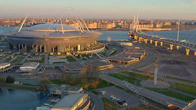 Russia, St.Petersburg, 06 May 2020: Aerial video of Gazprom arena stadium at sunset, highway and cable bridge, Western