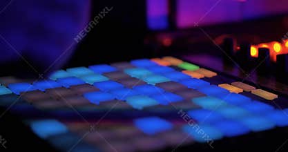 DJ Sound Control Console. Musical Equipment. Playing on Synthesizers. Close-up. Concert. Night Club Party. Sound Engineer Adjusts