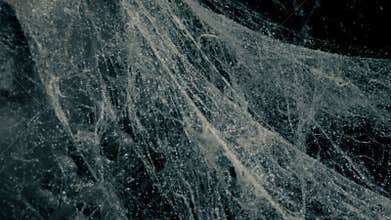 Spiderwebs Swaying In Breeze In Dark Room Or Cave