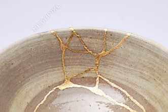 Antique broken bowl repaired with gold kintsugi technique