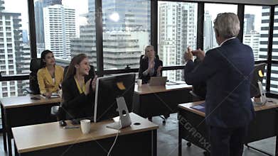 Senior leader giving advice speech to team members