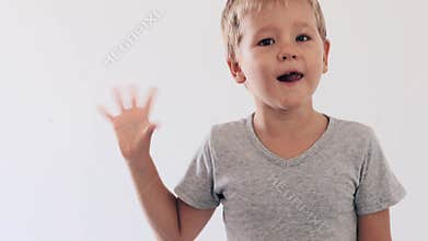 Boy waving by hand