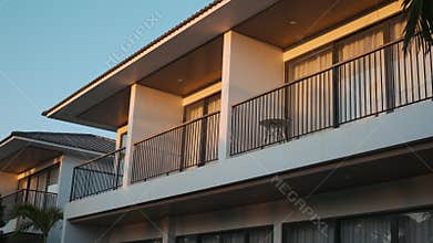 Two-storeyed apartment hotel at sunset